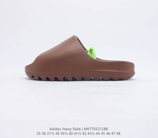 阿迪达斯 Adidas YEEZY SLIDE 经典运动拖鞋时尚厚底增高男女一字拖鞋 YEEZY SLIDE椰子拖鞋的外观十分吸引人 融合了舒适与时尚的元素 延