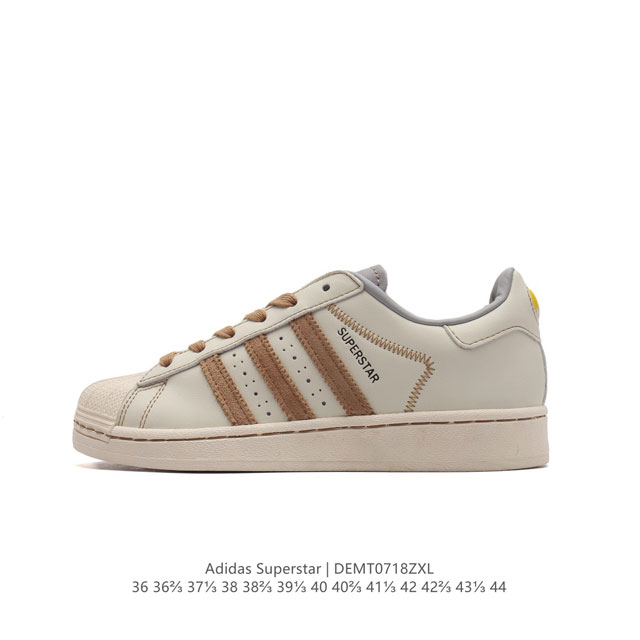 阿迪达斯 Adidas Superstar 三叶草经典贝壳头系列 新款休闲板鞋潮流男女士运动鞋 。鞋面柔软皮革材质 标志性的贝壳鞋头，锯齿三条纹，简约的线条。就