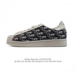 阿迪达斯 Adidas Superstar 2025年新款鞋子 蛇年新款 迪奥联名 经典贝壳头系列 新款休闲板鞋潮流男女士运动鞋 。鞋面织物拼接材质 标志性的贝