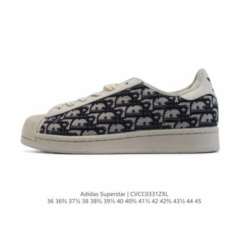 阿迪达斯 Adidas Superstar 2025年新款鞋子 蛇年新款 迪奥联名 经典贝壳头系列 新款休闲板鞋潮流男女士运动鞋 。鞋面织物拼接材质 标志性的贝