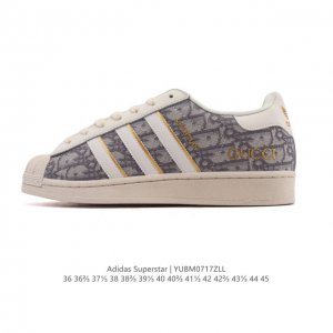 阿迪达斯 Adidas Superstar 2025年新款鞋子 蛇年新款 迪奥联名 经典贝壳头系列 新款休闲板鞋潮流男女士运动鞋 。鞋面织物拼接材质 标志性的贝